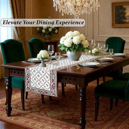 Dining room with a wooden table set for dinner, green chairs, and decorative elements.