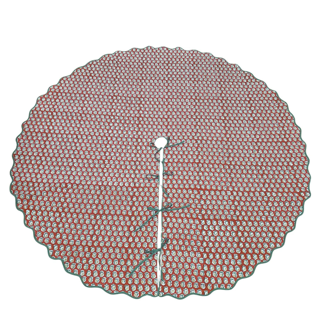 Round red and white patterned tree skirt on a white background
