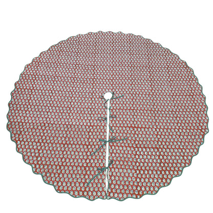 Round red and white patterned tree skirt on a white background