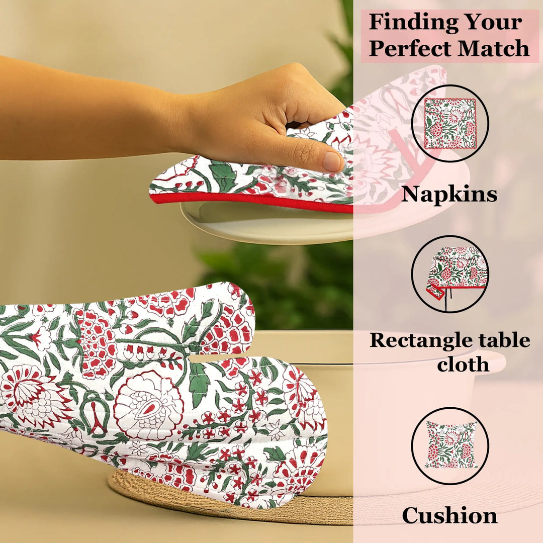 Floral-patterned tablecloth, napkins, and cushion on a beige surface with text &