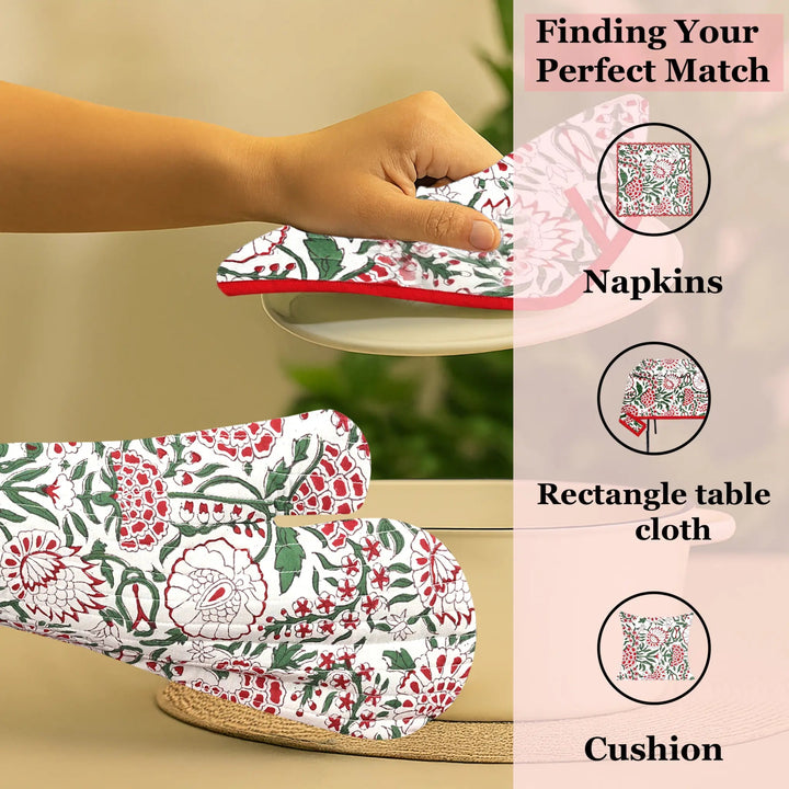 Floral-patterned tablecloth, napkins, and cushion on a beige surface with text &
