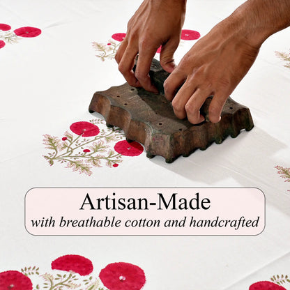 Hands using a brick mold on a white surface with red floral patterns, text 'Artisan-Made with breathable cotton and handcrafted' below.