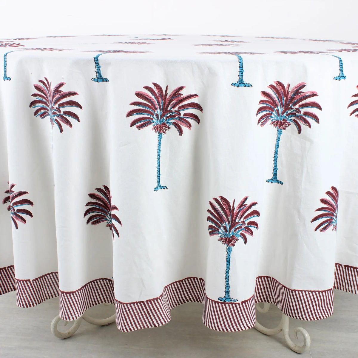 Tablecloth with palm tree design on a wooden table