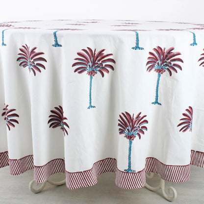 Tablecloth with palm tree design on a wooden table