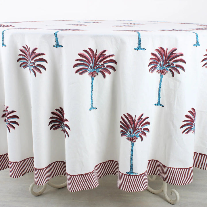 Tablecloth with palm tree design on a wooden table