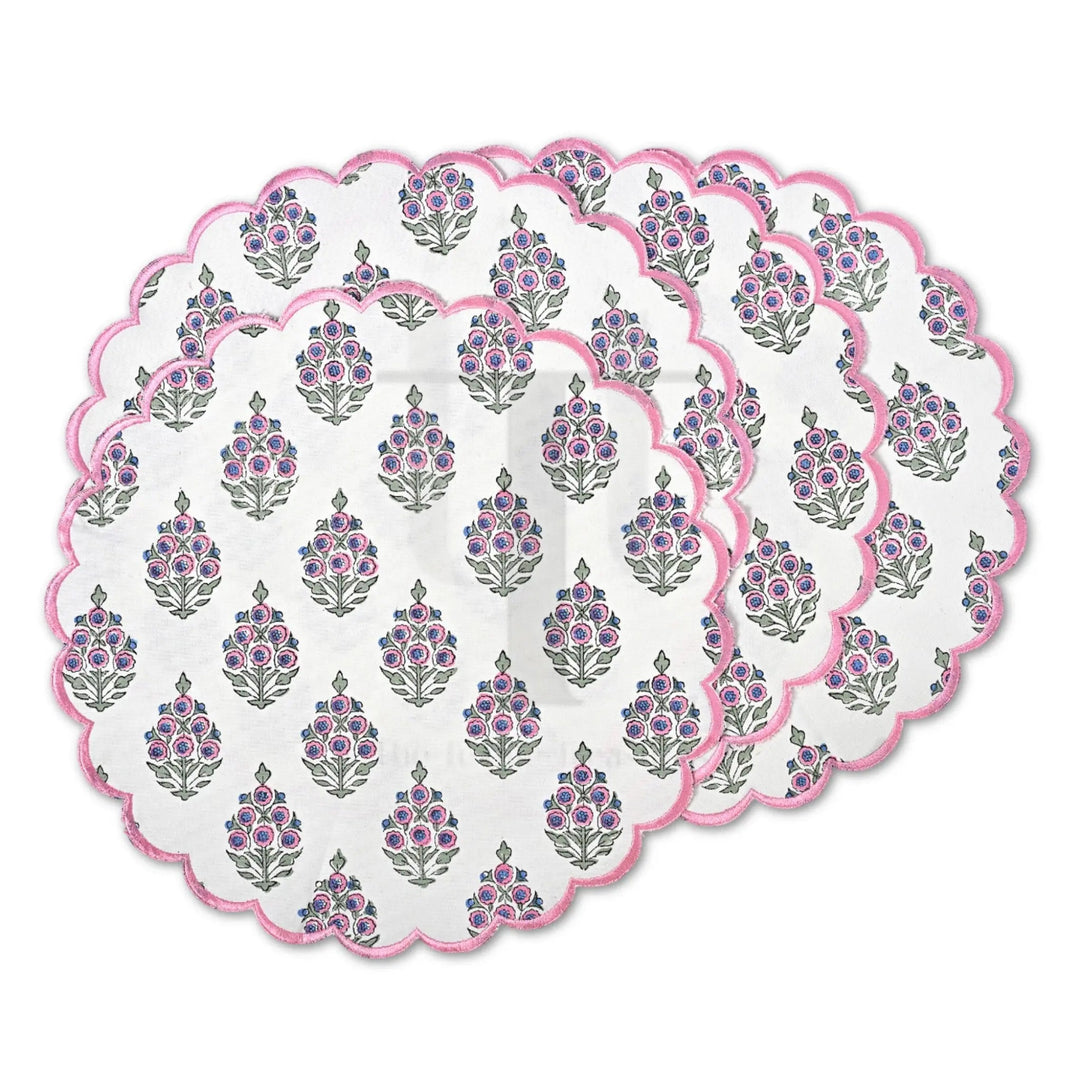 Set of round placemats with floral pattern on a white background