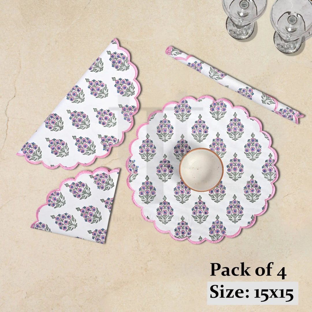 Set of floral table mats and coasters on a beige surface with text indicating &