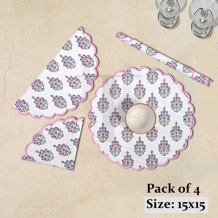 Set of floral table mats and coasters on a beige surface with text indicating &