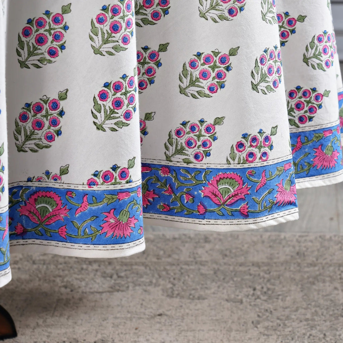 Close-up of a fabric with floral patterns on a textured surface