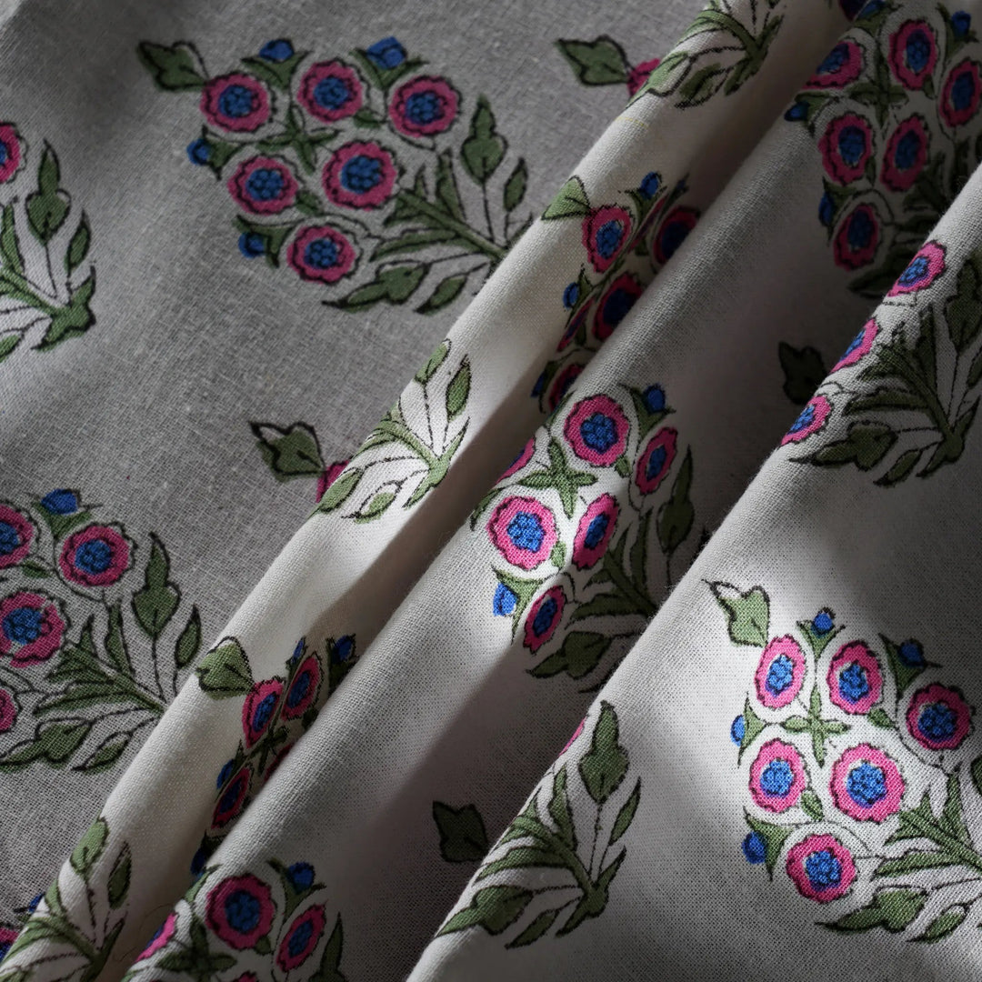 Fabric with floral embroidery pattern on a gray background