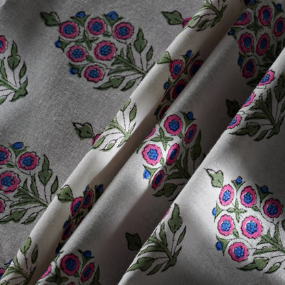 Fabric with floral embroidery pattern on a gray background