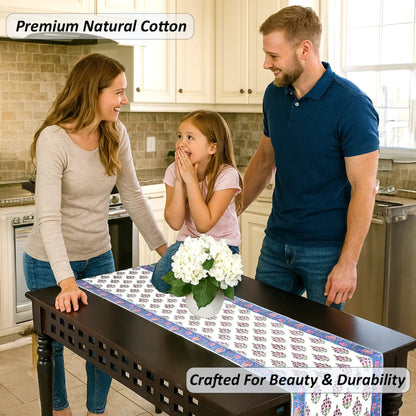 Family in a kitchen with a table runner displaying 'Premium Natural Cotton' and 'Crafted For Beauty & Durability'.