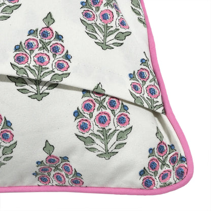 Floral patterned fabric with pink border on a white background