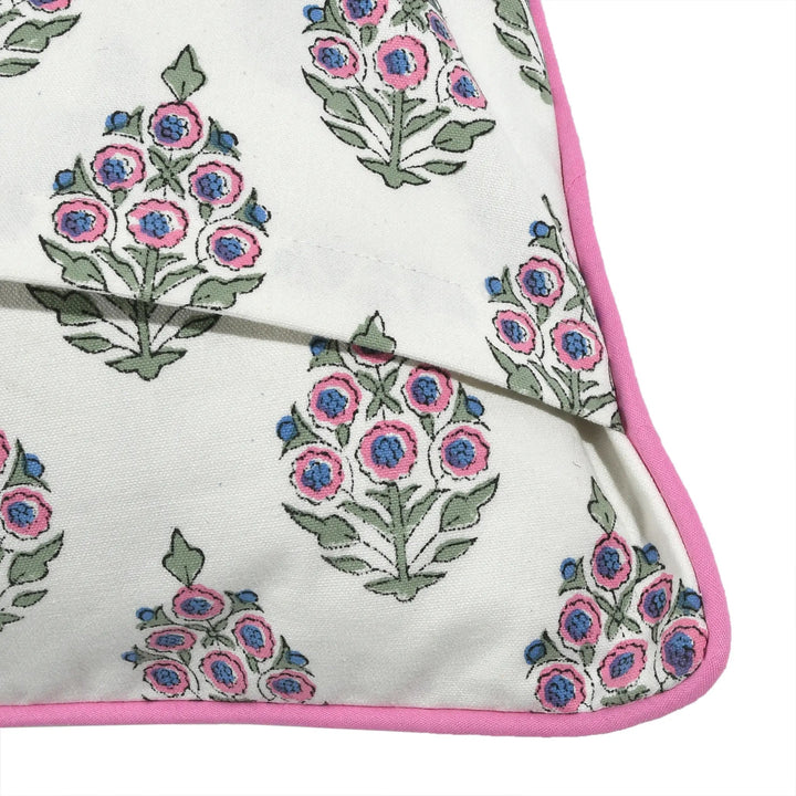 Floral patterned fabric with pink border on a white background