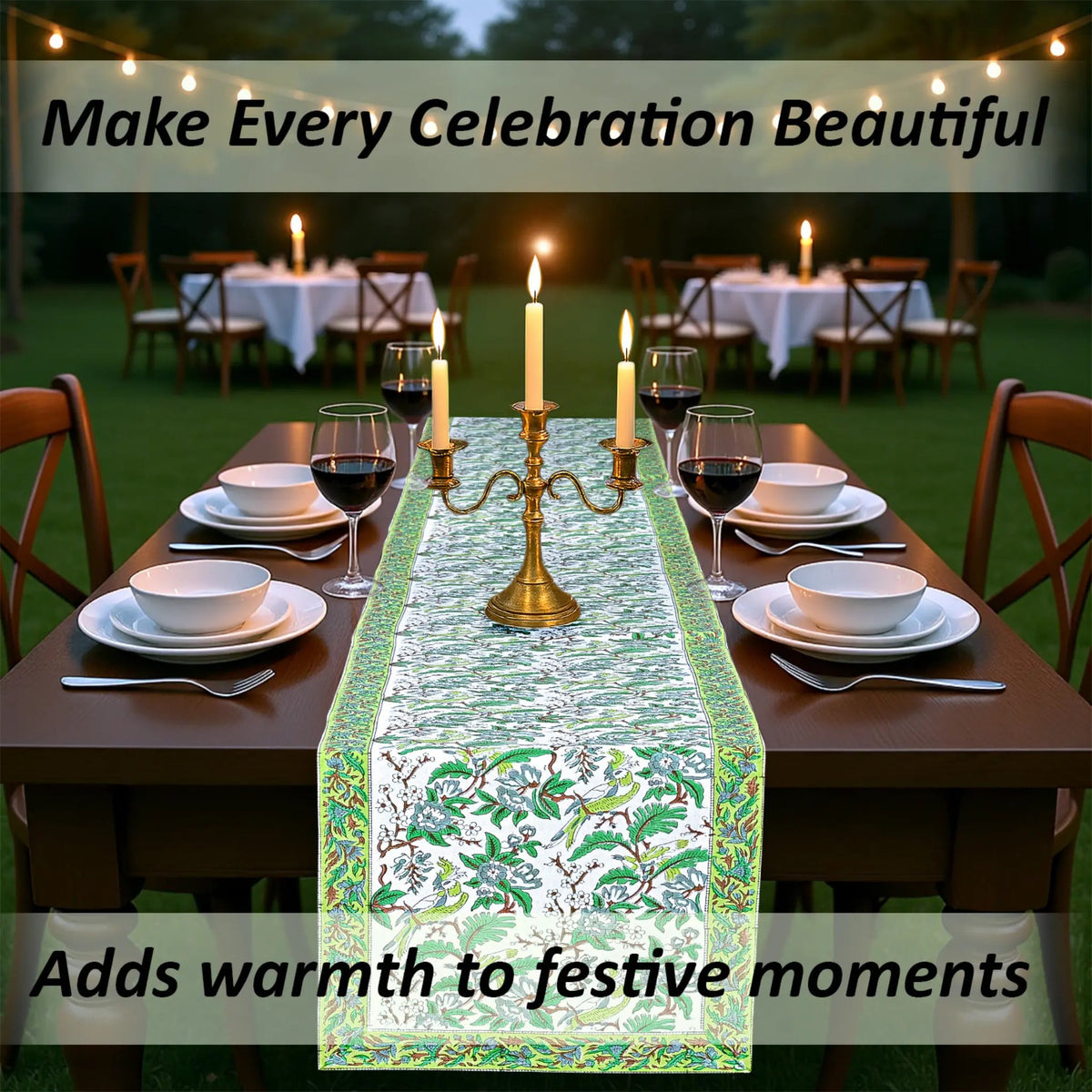Dining table set with a decorative table runner, candles, and wine glasses outdoors.