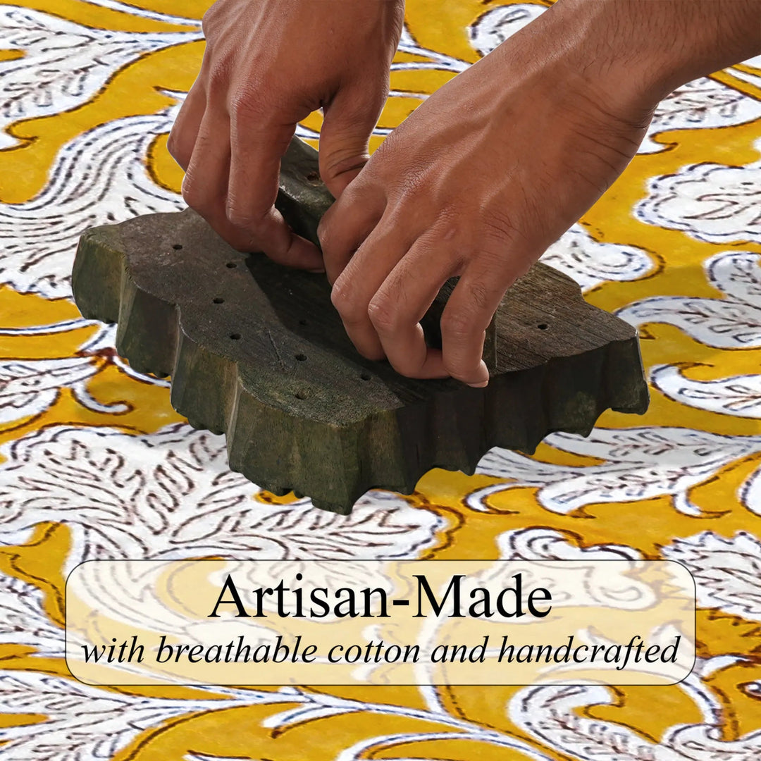 Hands using a stamp on fabric with &