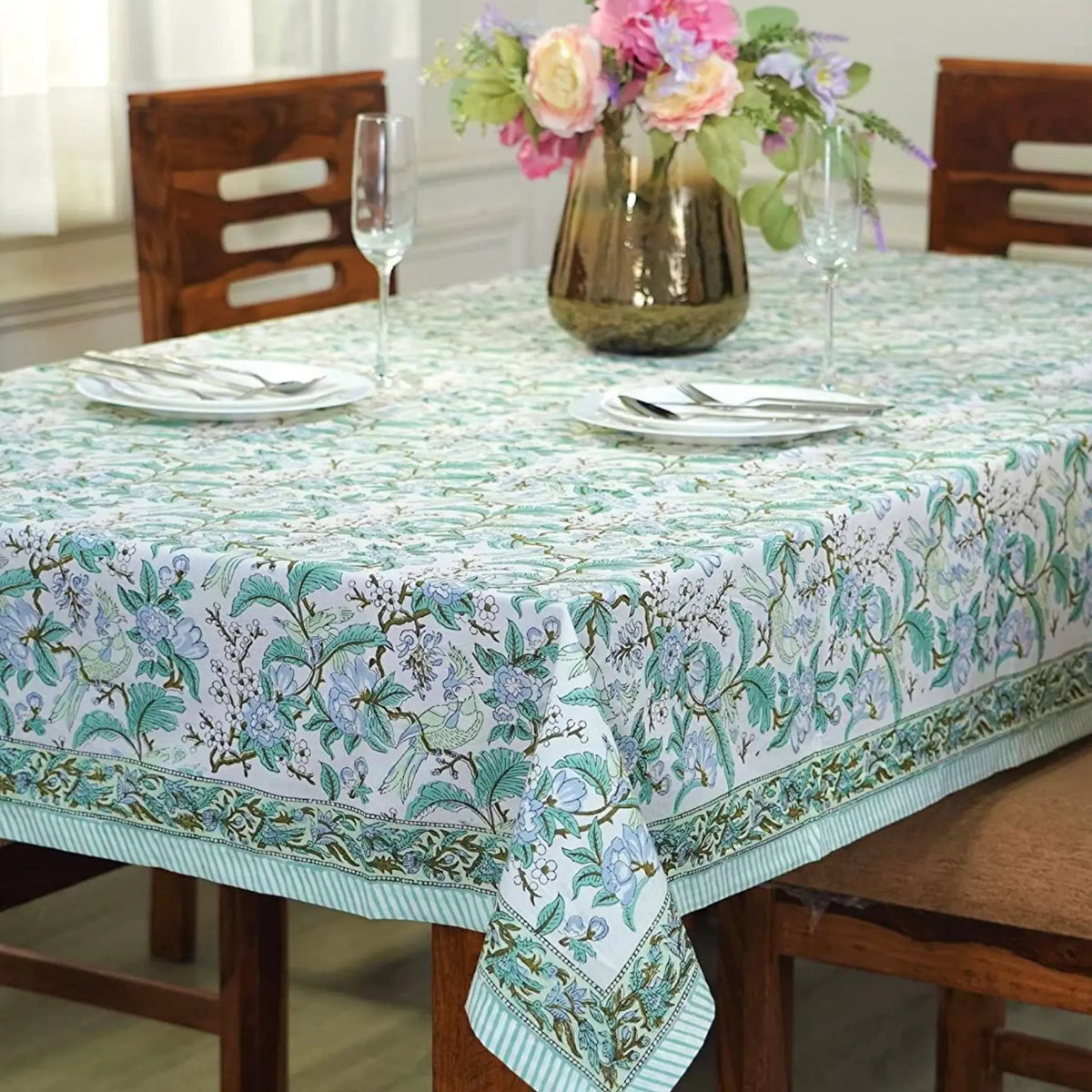 Tablecloth with floral pattern on a set dining table