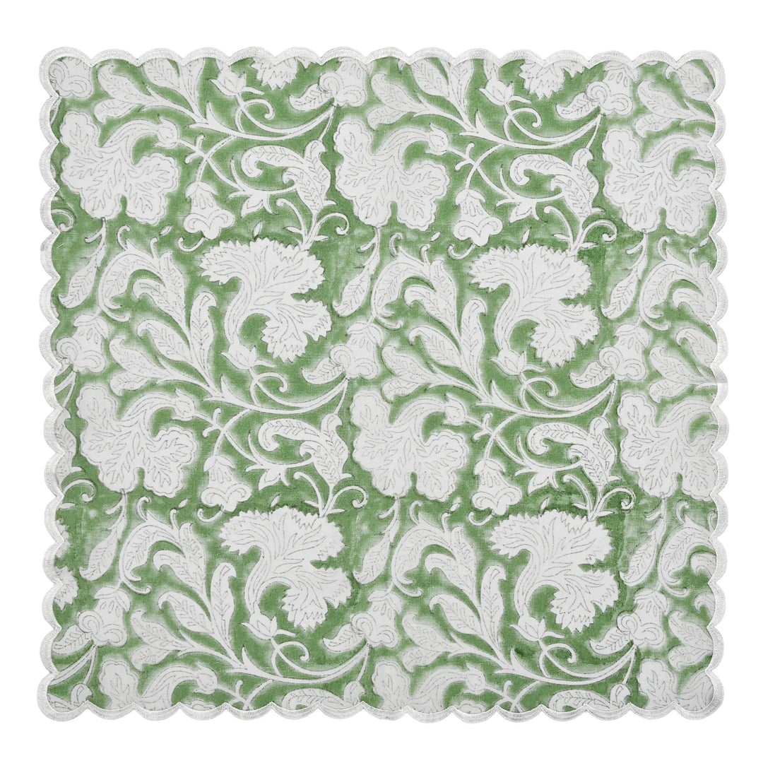 Decorative square mat with white floral pattern on a green background