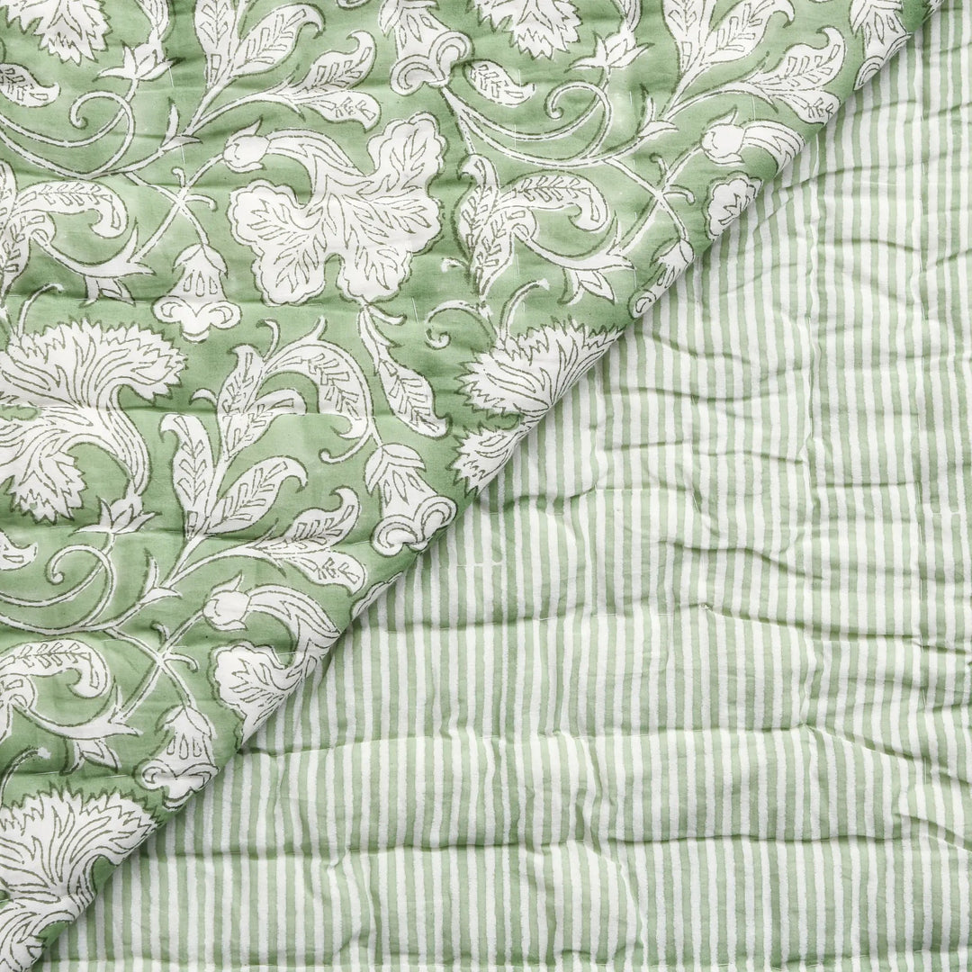 Two green textured fabrics with different patterns on a white background
