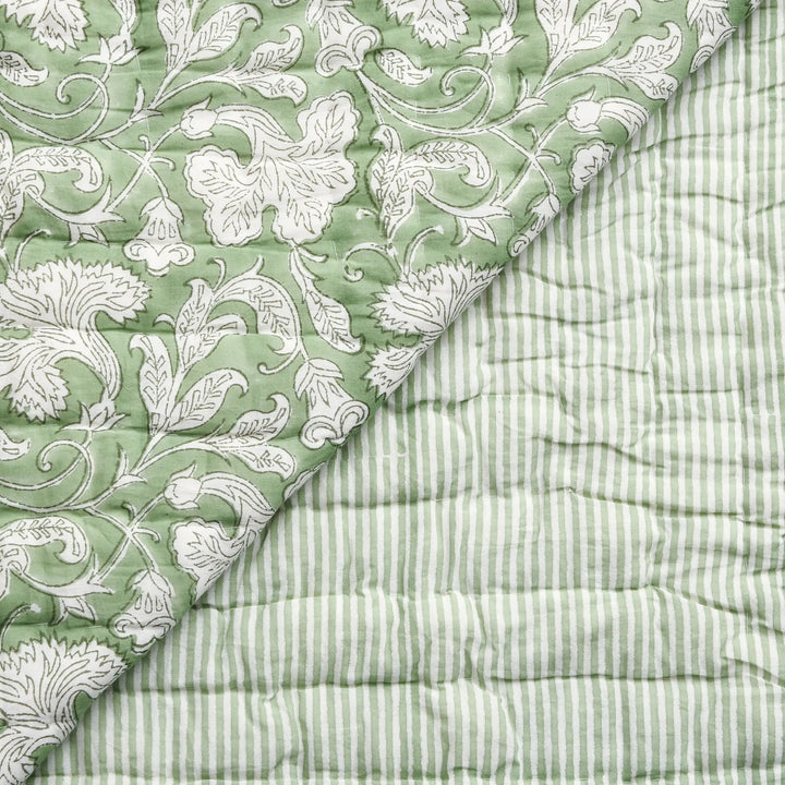 Two green textured fabrics with different patterns on a white background