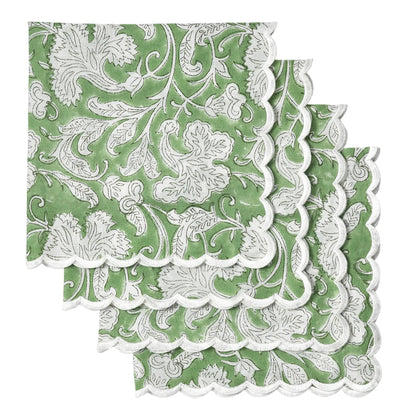 Green and white floral patterned paper napkins with scalloped edge on a white background