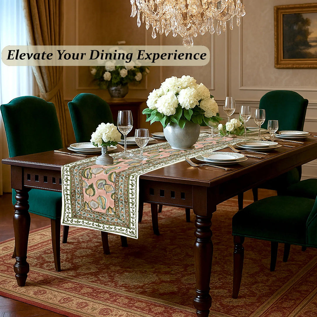 Dining room with a table set for dinner, flowers, and a chandelier.