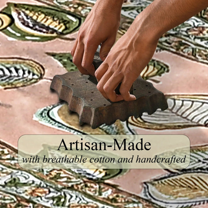 Hands using a stamp on a piece of fabric with &