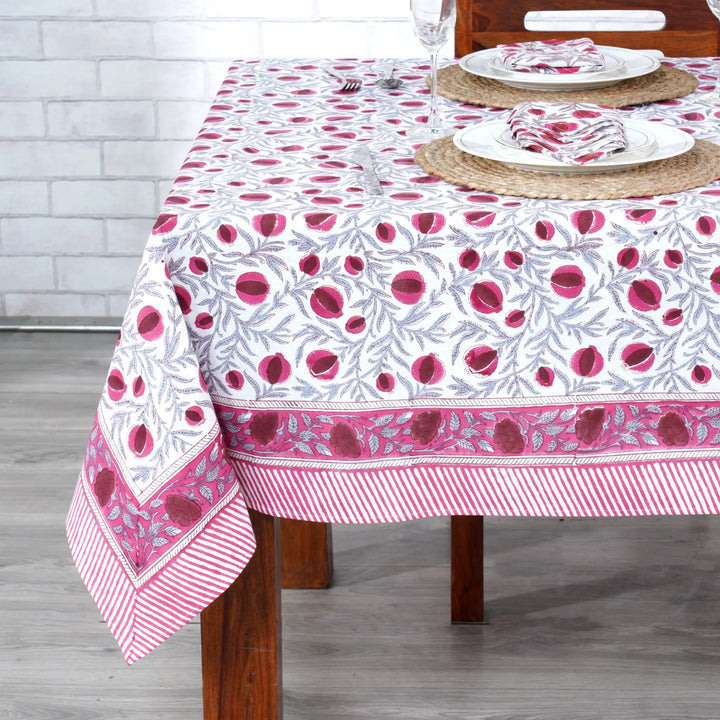 Tablecloth with pink floral pattern on a wooden table