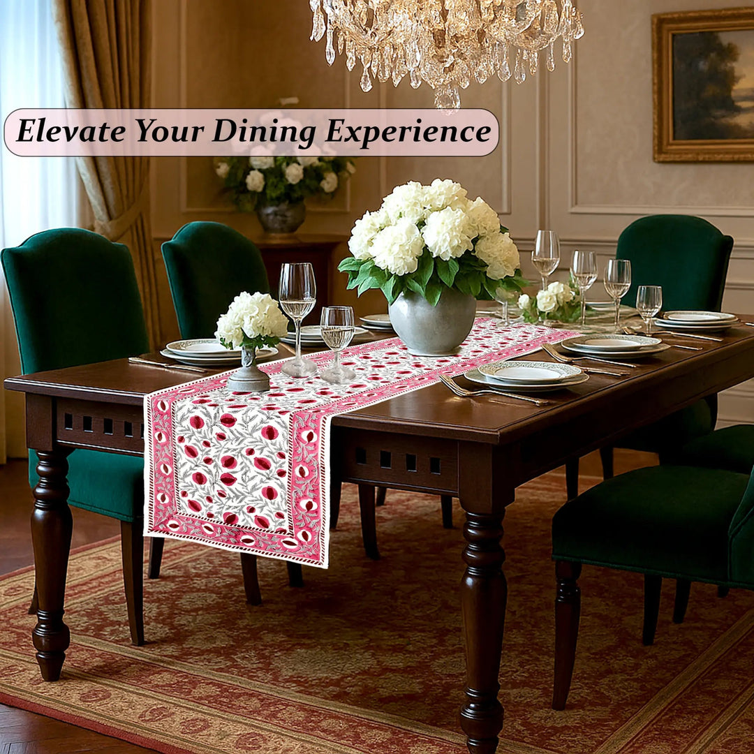 Dining room with a table set for dinner, flowers, and elegant decor.