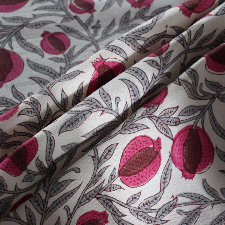 Fabric with pomegranate pattern on a light background