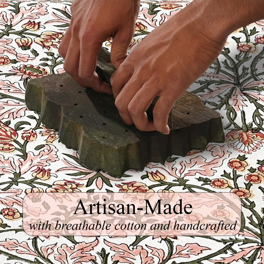 Hands using a stamp on floral fabric with &