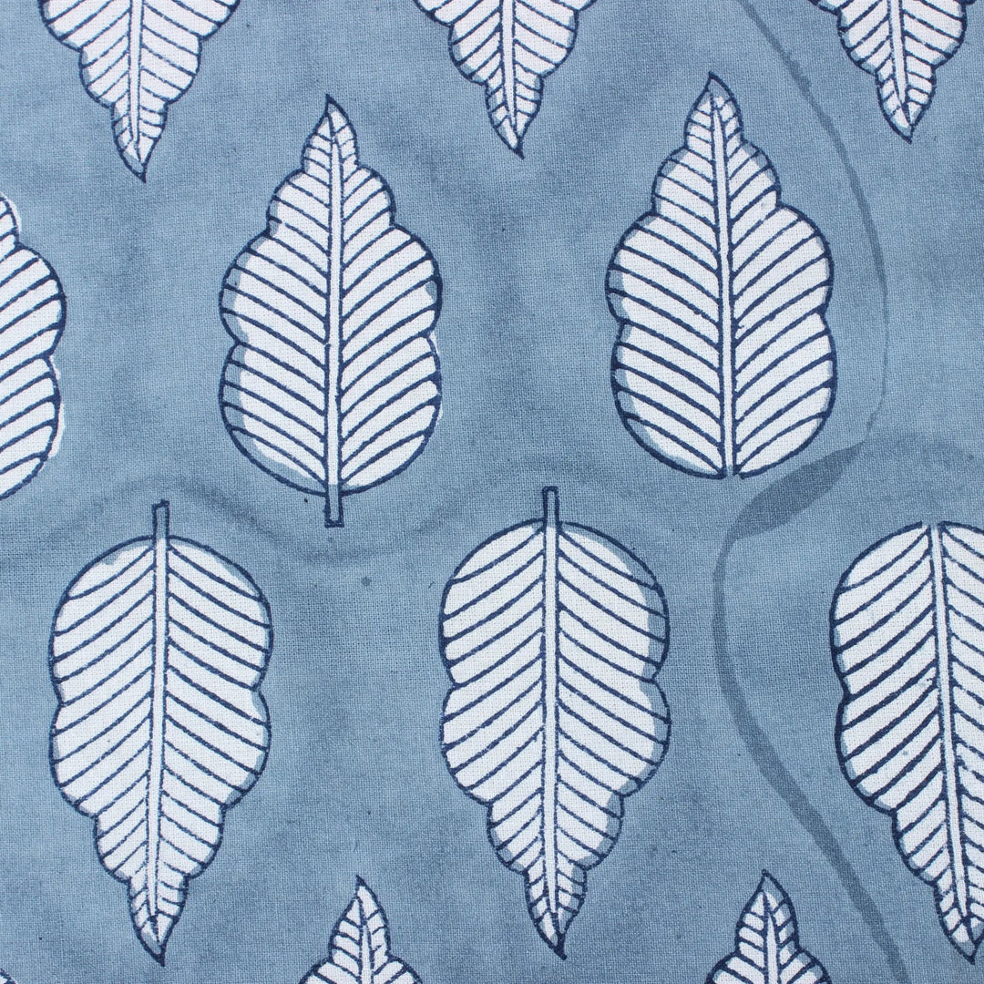 Pattern of white leaves on a blue background