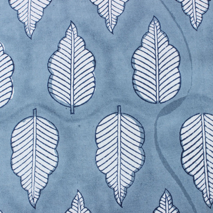 Pattern of white leaves on a blue background