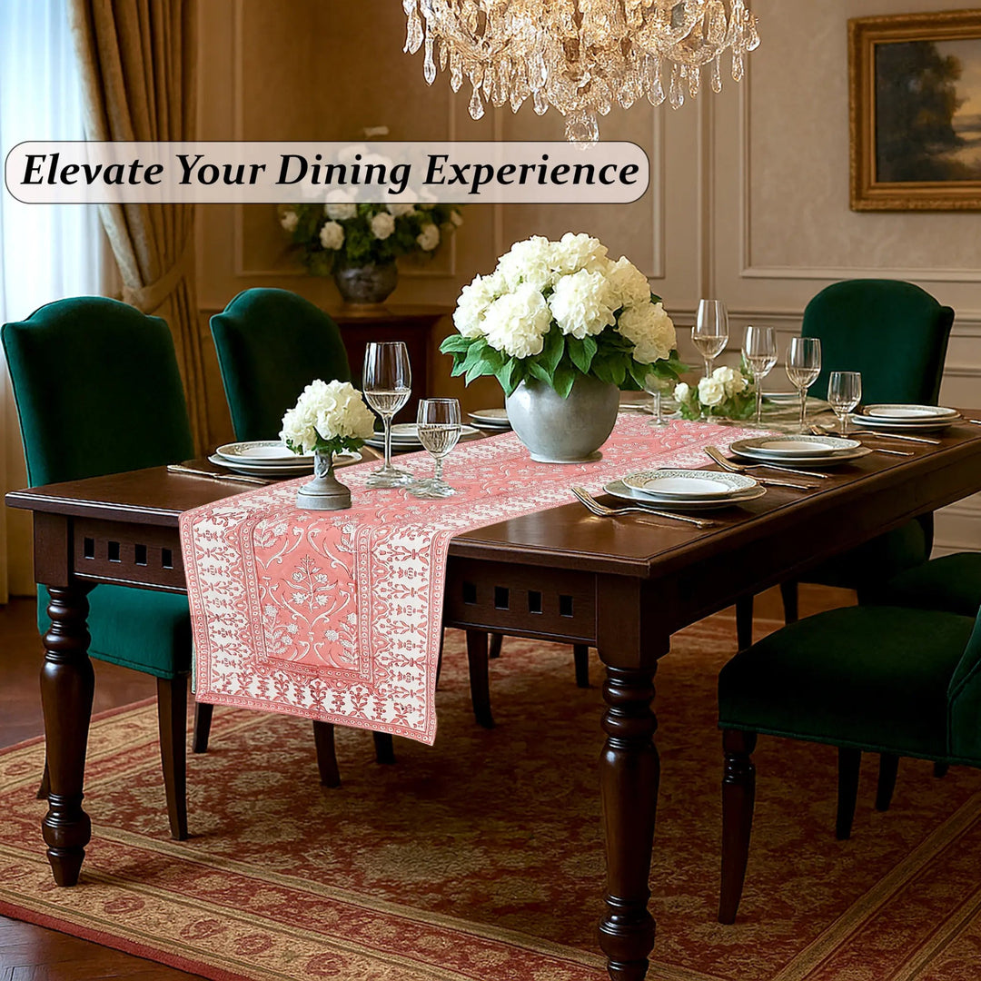 Dining room with a table set for dinner, flowers, and a chandelier.