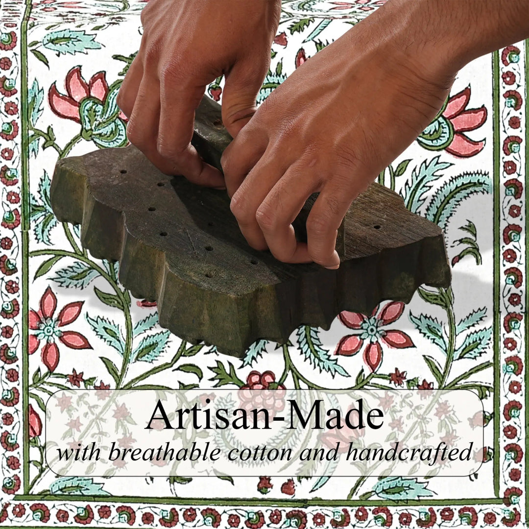 Hands using a wooden tool on a floral patterned background with &