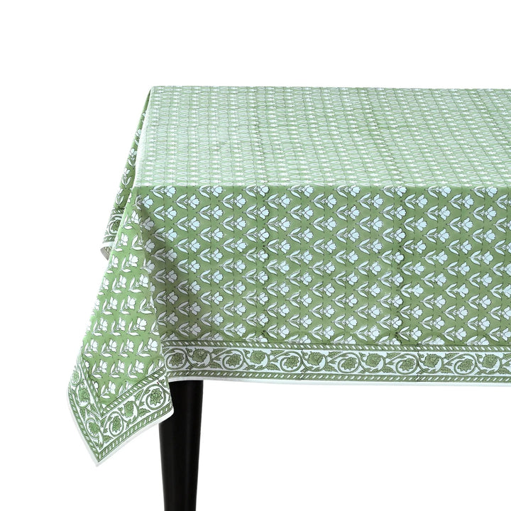 Green patterned tablecloth on a white background