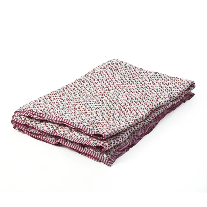 Folded fabric with a subtle pattern on a white background