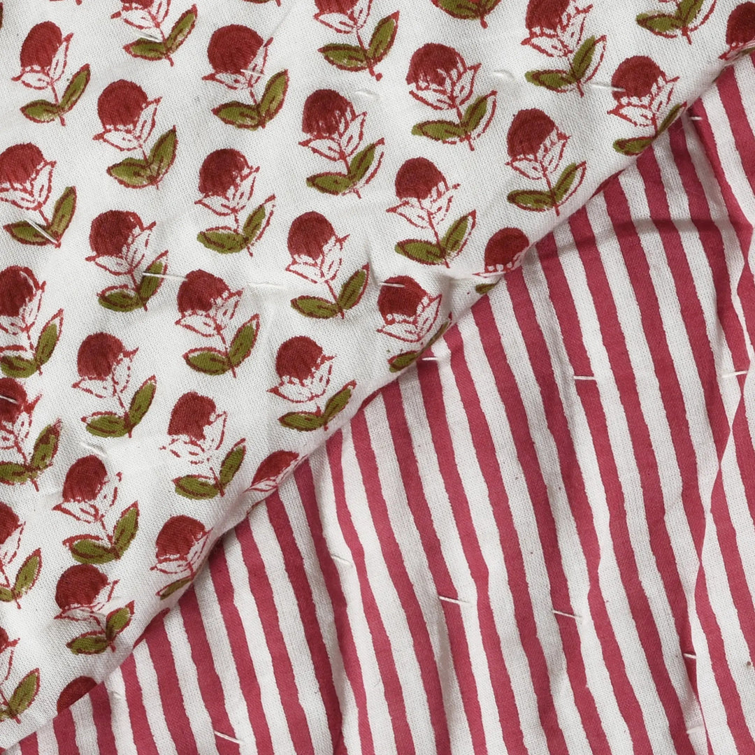 Two fabric swatches with floral pattern and red and white stripes.