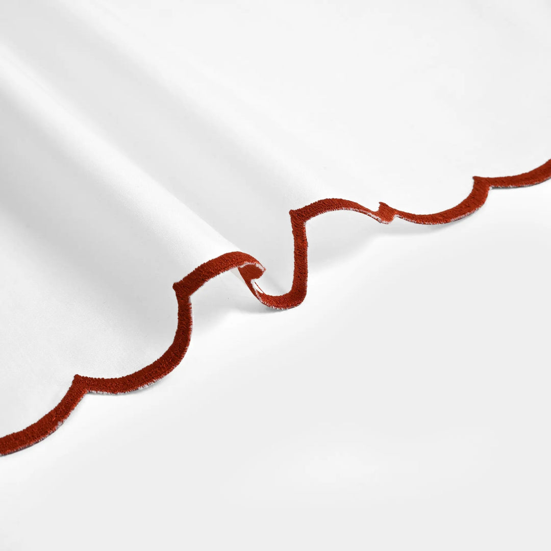 Close-up of red velvet trim on a white background