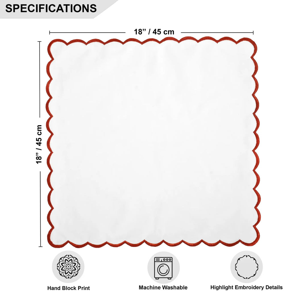 White placemat with red scalloped edge and measurements on a white background